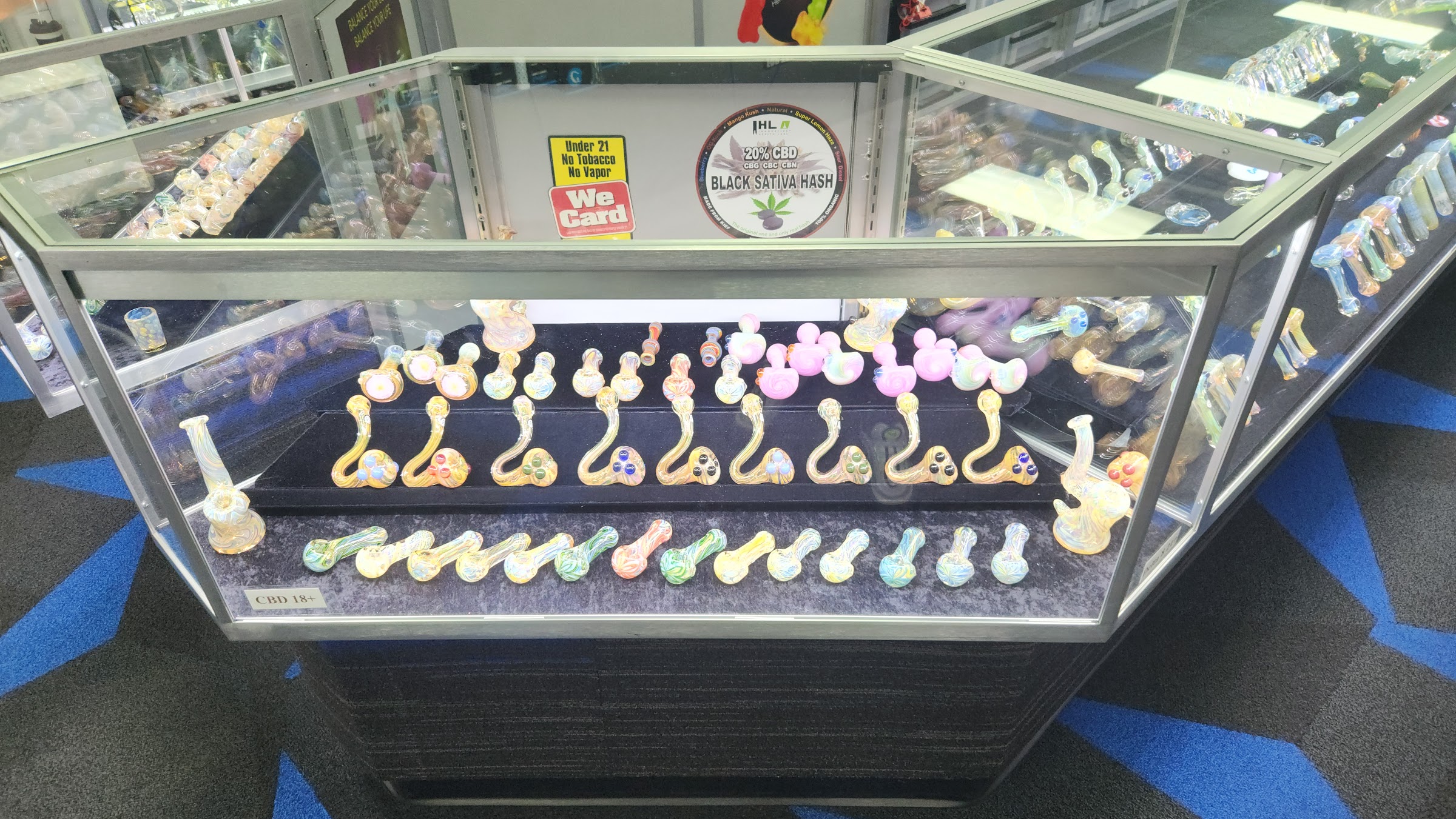 Glass display case with colorful glass pipes